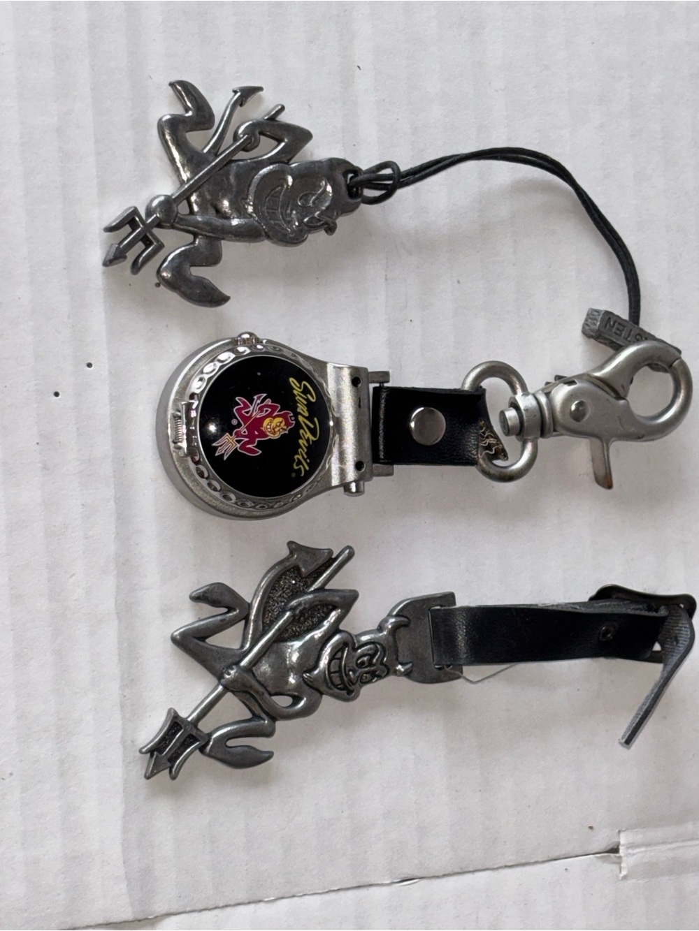 ASU Golf Bag Charm With Sparky And A Sun Devil Watch.